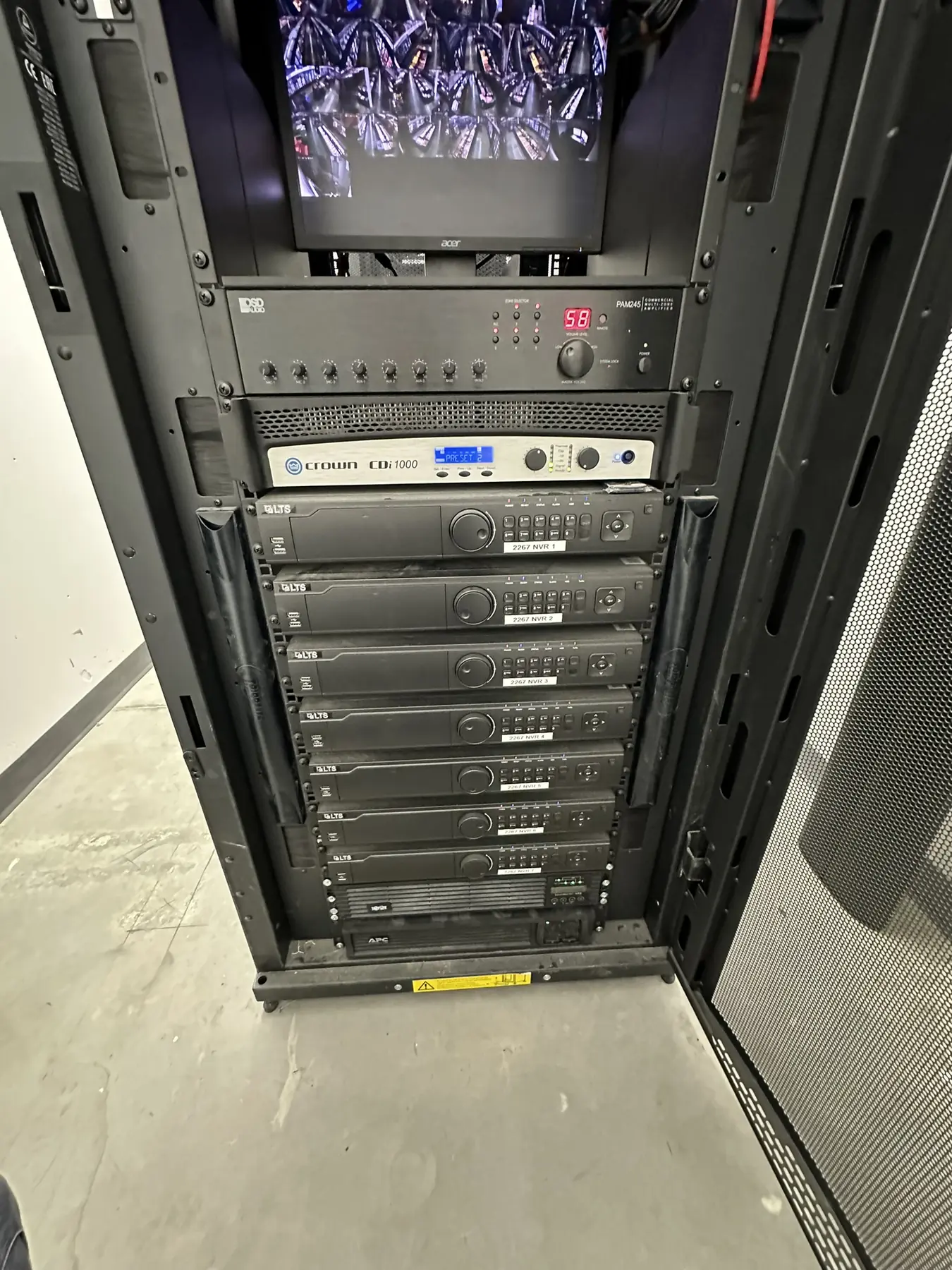 Commercial video recording and paging equipment installed in a floor rack